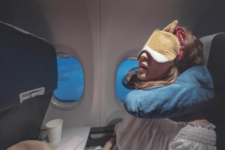How to Sleep on a Plane: 15 Tips for Actually Getting Some Rest at 35,000 Feet